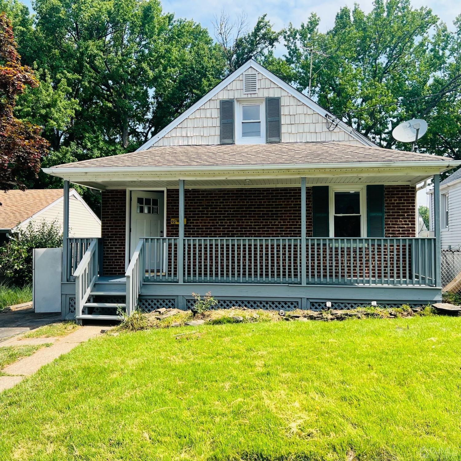 92 Highfield Road Colonia, NJ 07067 - Photo 2 of 25 a front view of a house with a yard