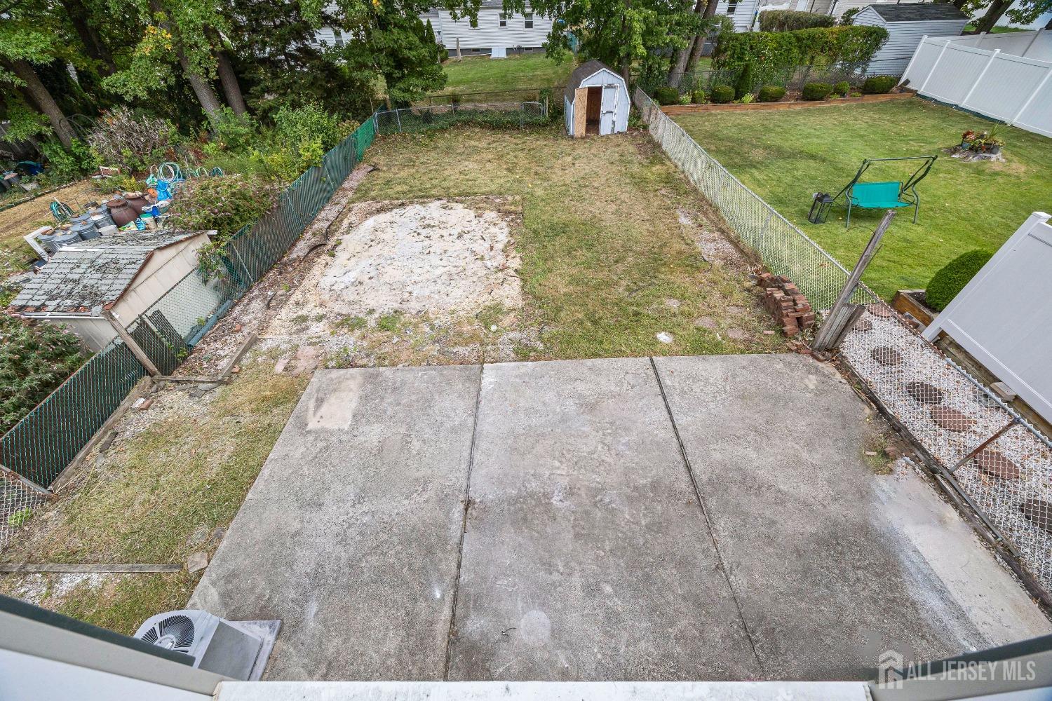 92 Highfield Road Colonia, NJ 07067 - Photo 23 of 25 a view of a yard with potted plants