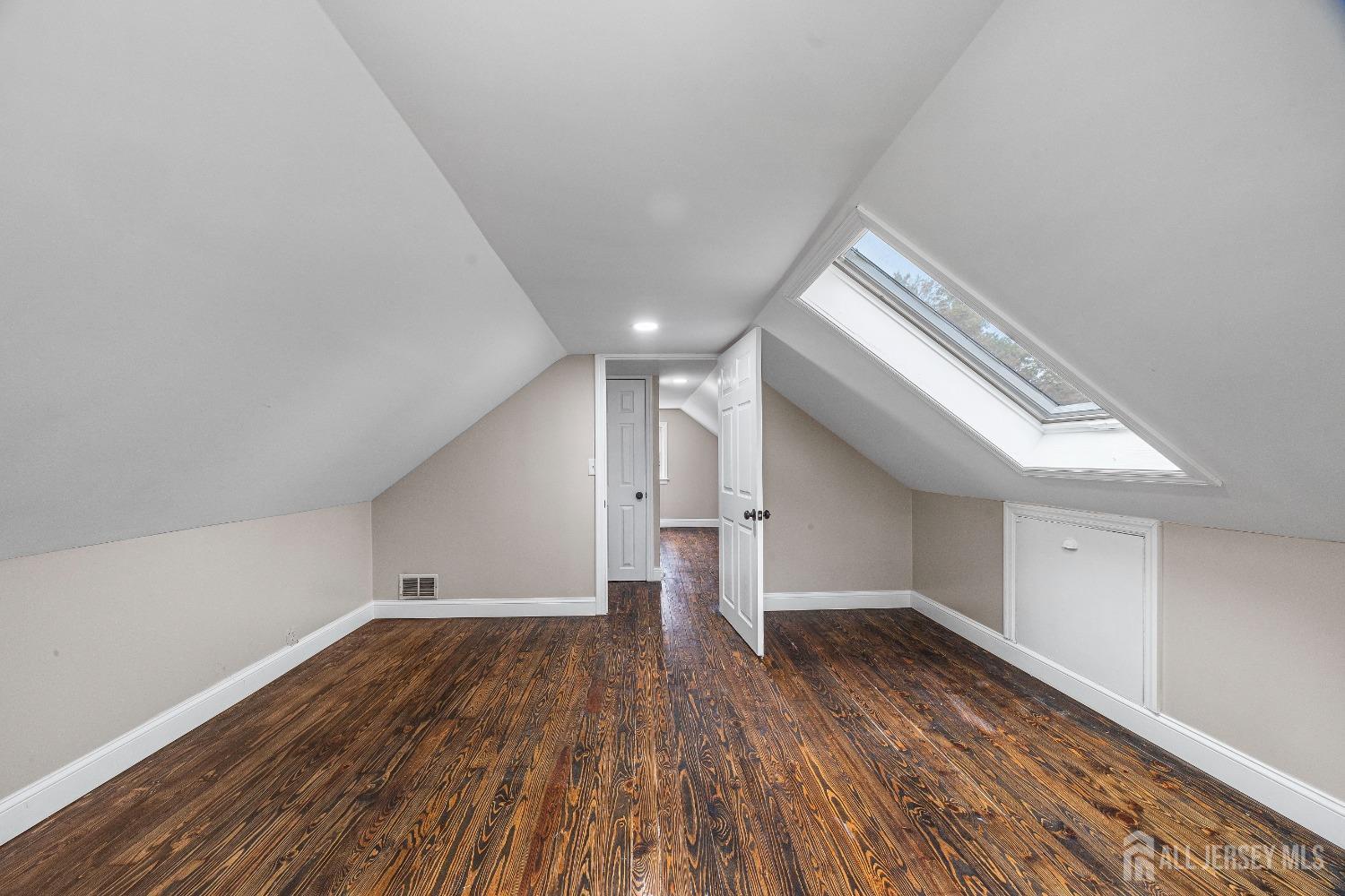 92 Highfield Road Colonia, NJ 07067 - Photo 24 of 25 a view of empty room with wooden floor