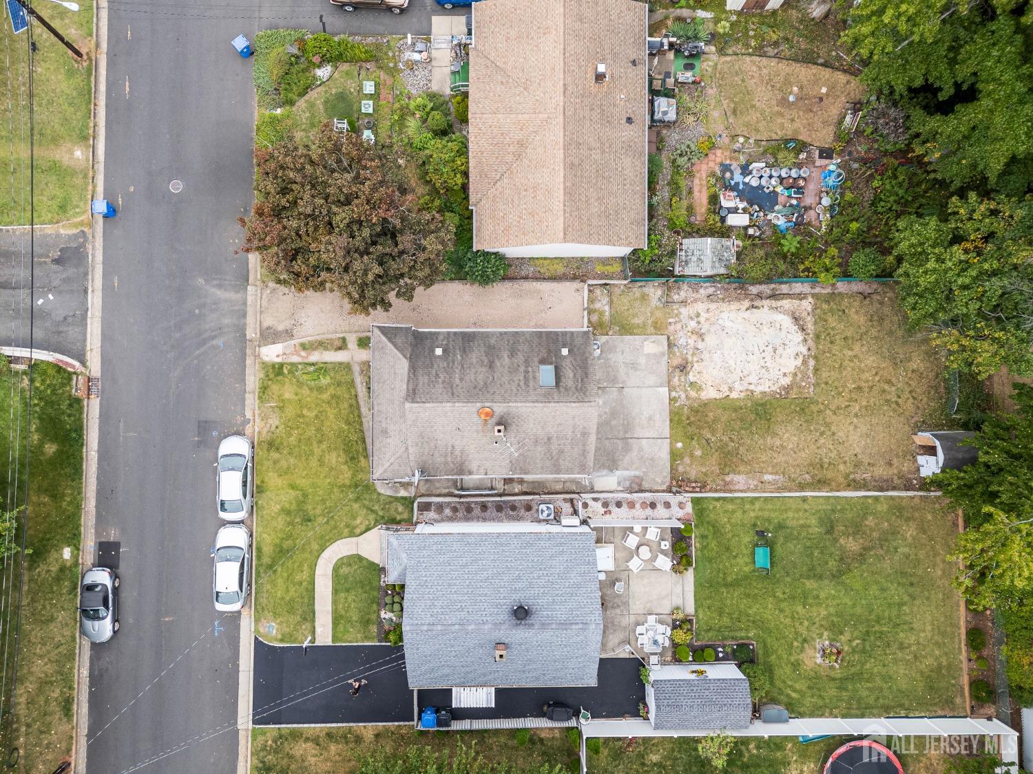 92 Highfield Road Colonia, NJ 07067 - Photo 5 of 25 an aerial view of a house with a yard