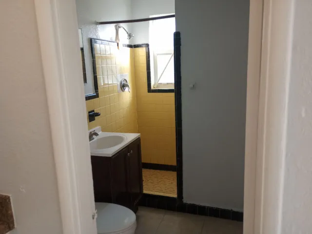a bathroom with a sink and mirror