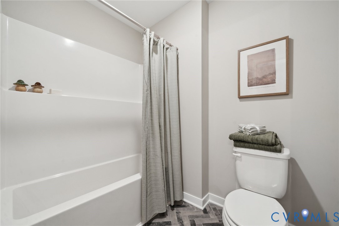 Lot 3 Kennington Aylett, VA 23009 - Photo 27 of 41 a bathroom with a toilet a sink and bathtub