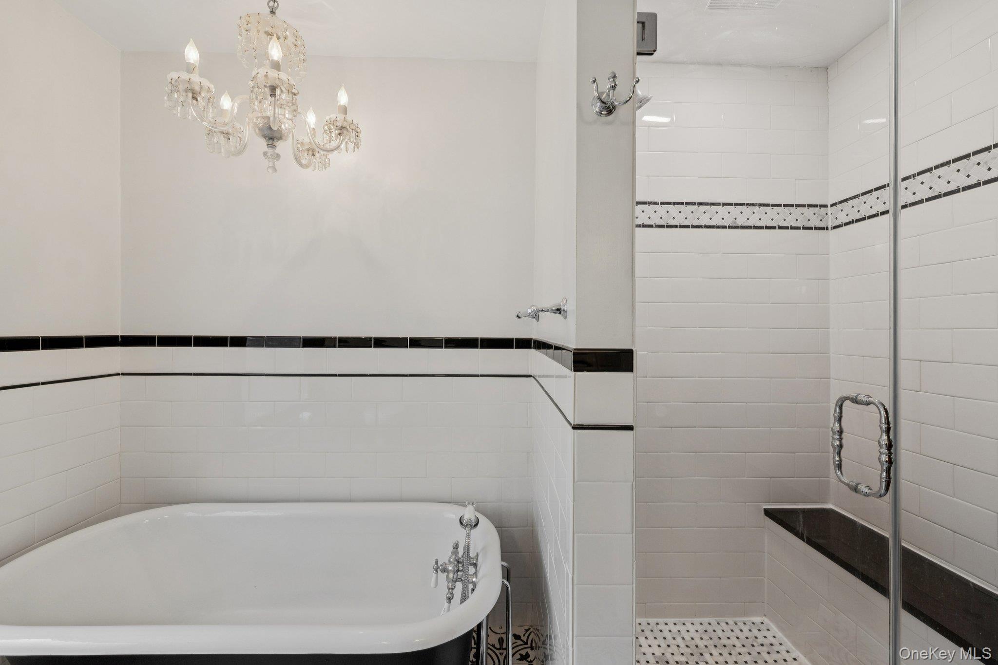 397 Split Rock Road Syosset, NY 11791 - Photo 17 of 29 a bathroom with a bathtub a shower and a toilet