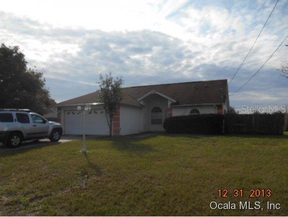 5946 Pecan Road Ocala, FL 34472 - Photo 1 of 1 a car parked in front of a house
