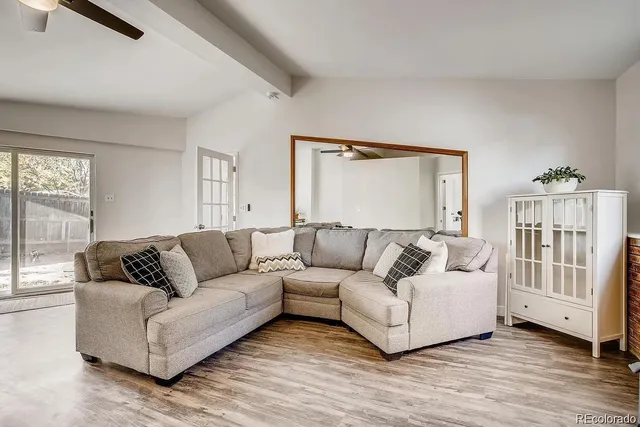 a living room with furniture and a window