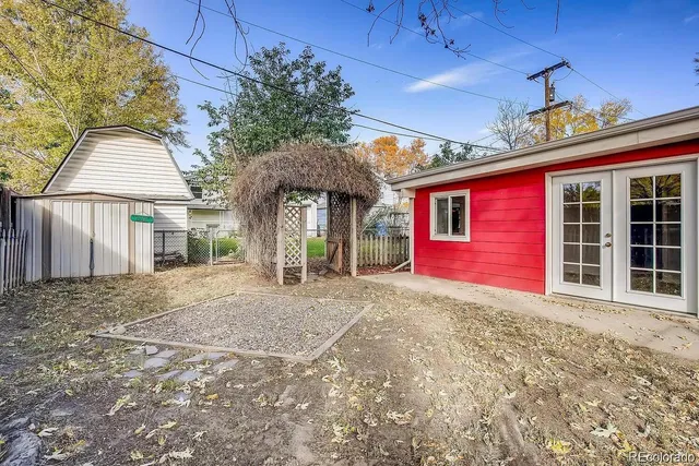 a view of a house with a backyard and porch