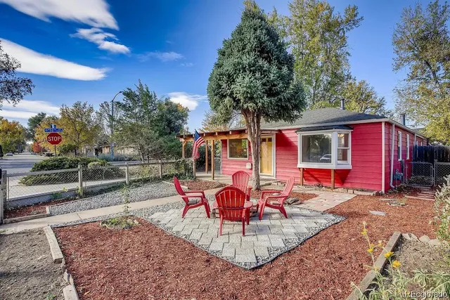 a view of a backyard with sitting area