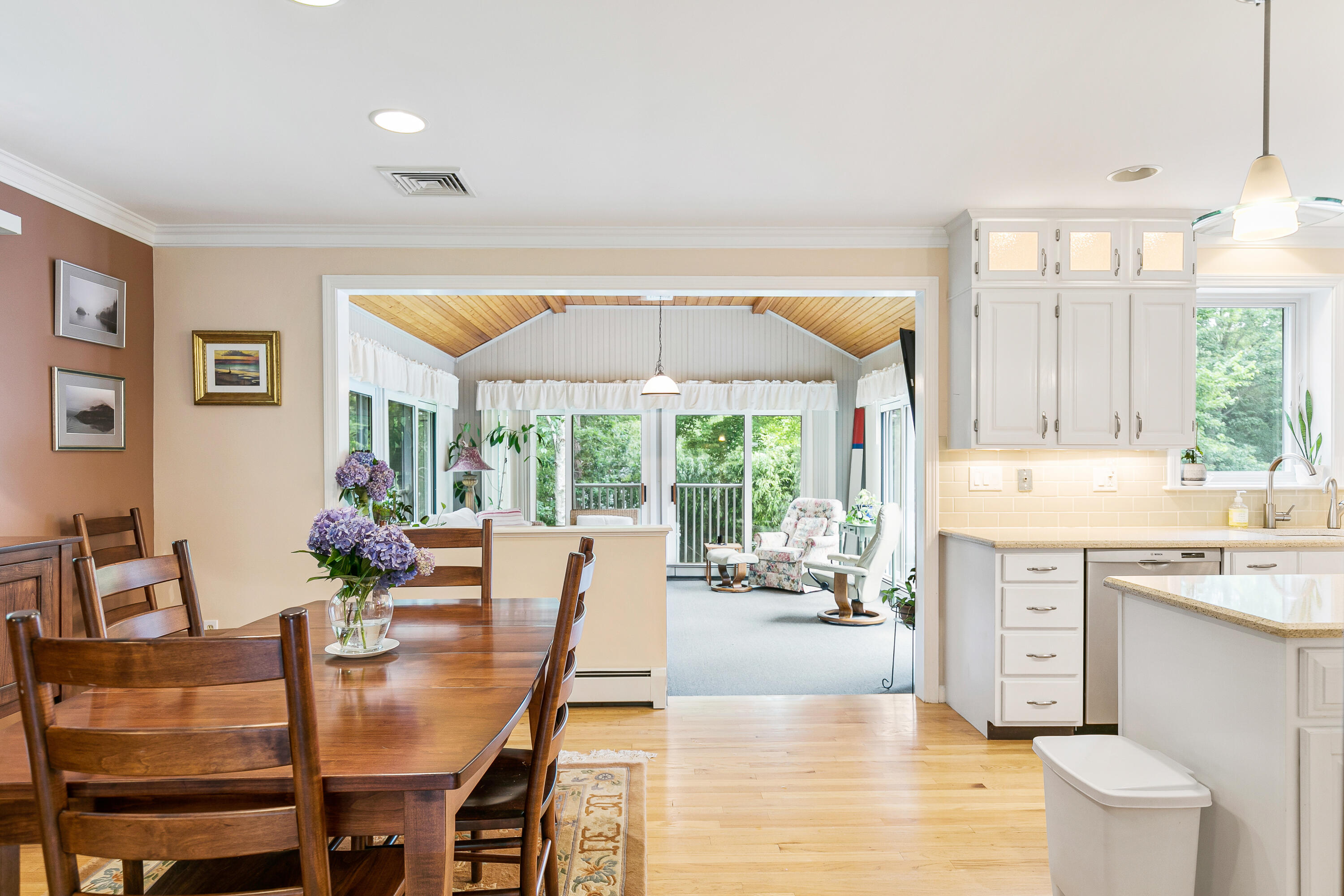 64 Hilltop Road Mashpee, MA 02649 - Photo 12 of 36 a dining hall with stainless steel appliances a table and chairs in it