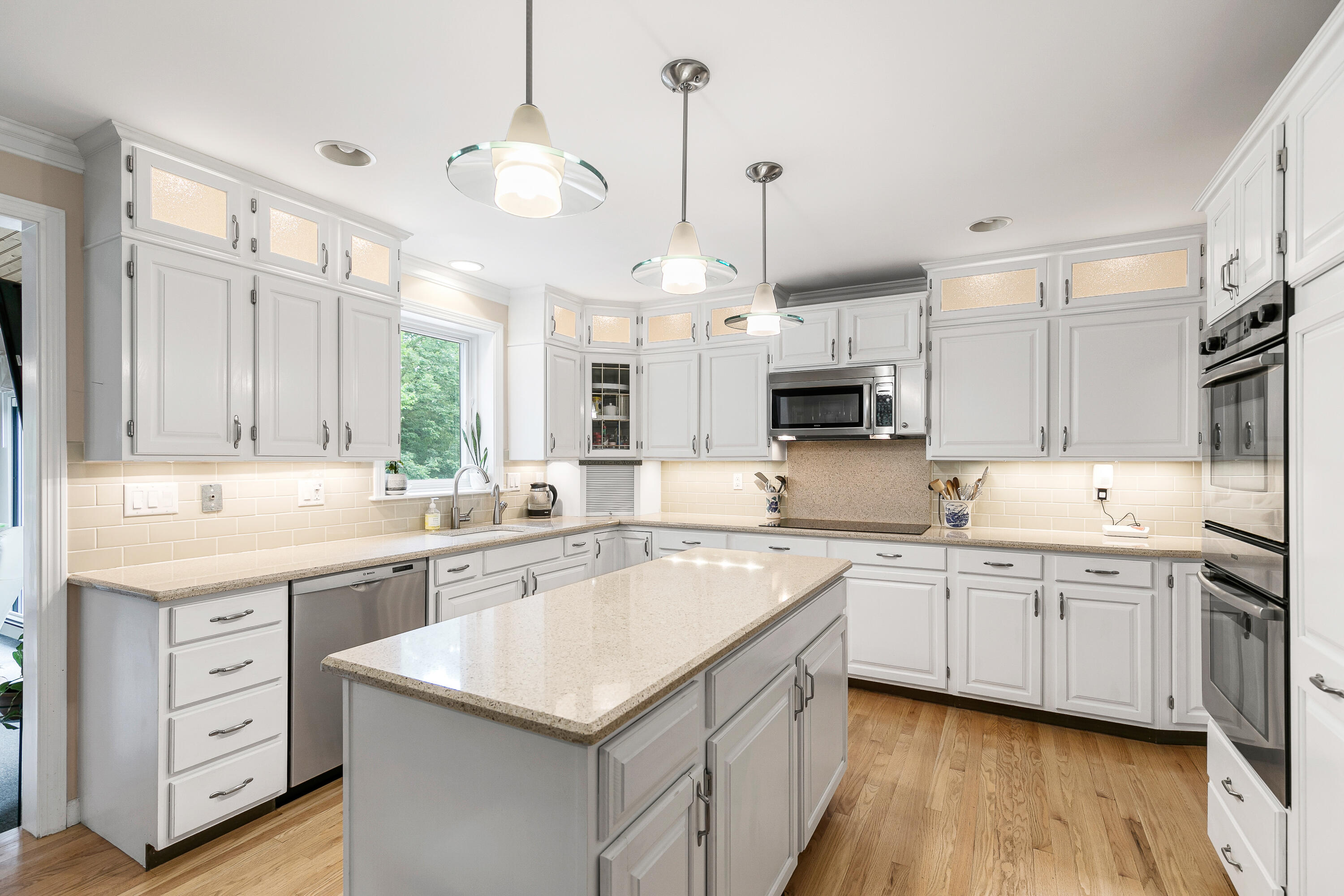 64 Hilltop Road Mashpee, MA 02649 - Photo 13 of 36 a kitchen with a sink stove and cabinets