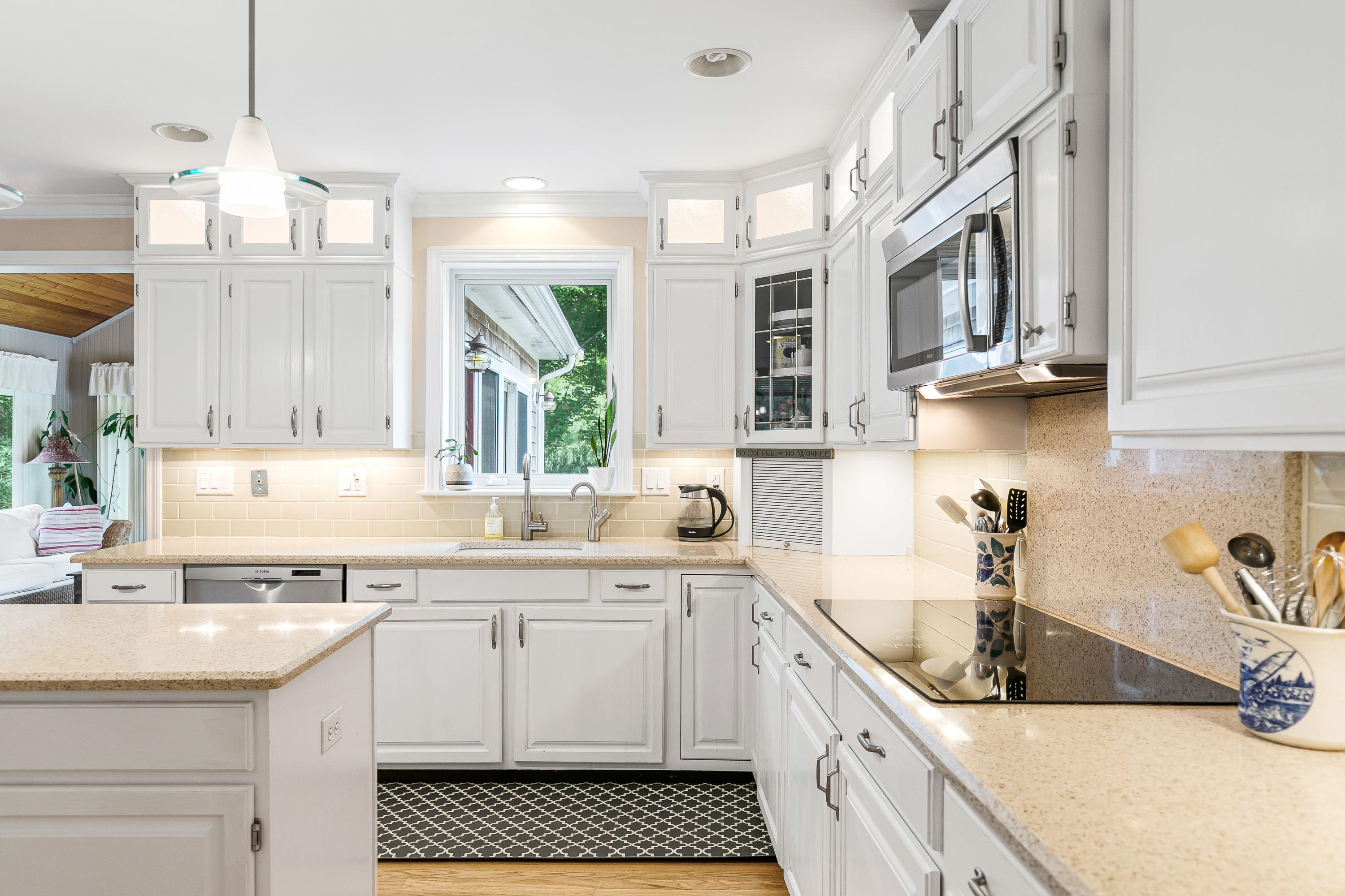64 Hilltop Road Mashpee, MA 02649 - Photo 16 of 36 a kitchen with a sink stove top oven and cabinets