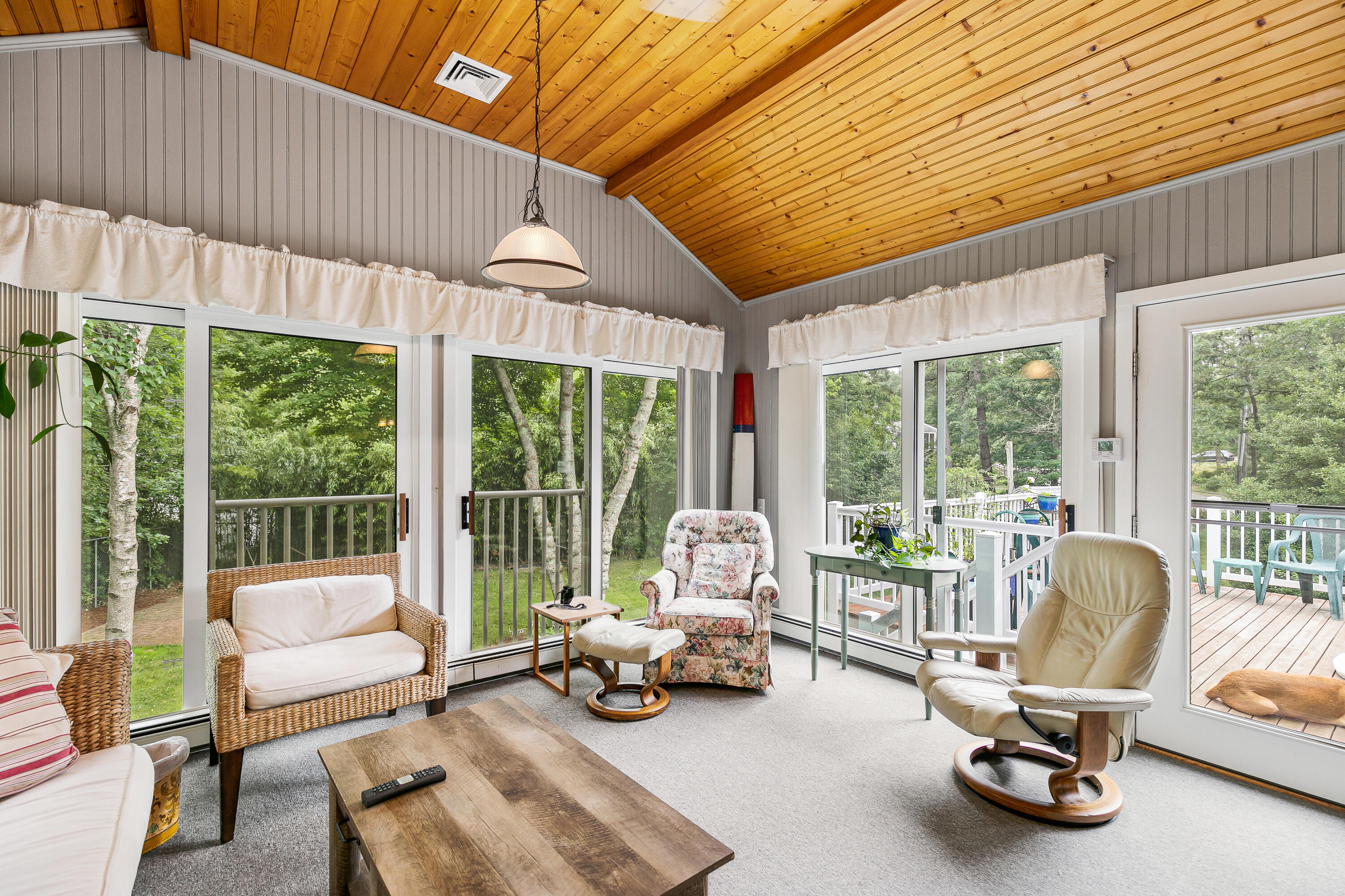 64 Hilltop Road Mashpee, MA 02649 - Photo 20 of 36 a view of a patio with a table chairs and a barbeque