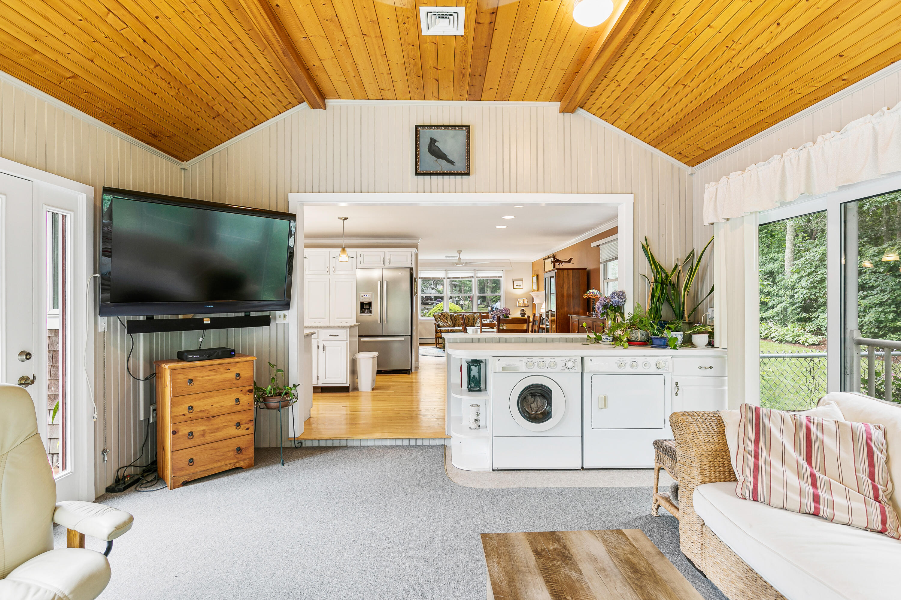 64 Hilltop Road Mashpee, MA 02649 - Photo 21 of 36 a living room with furniture and a flat screen tv