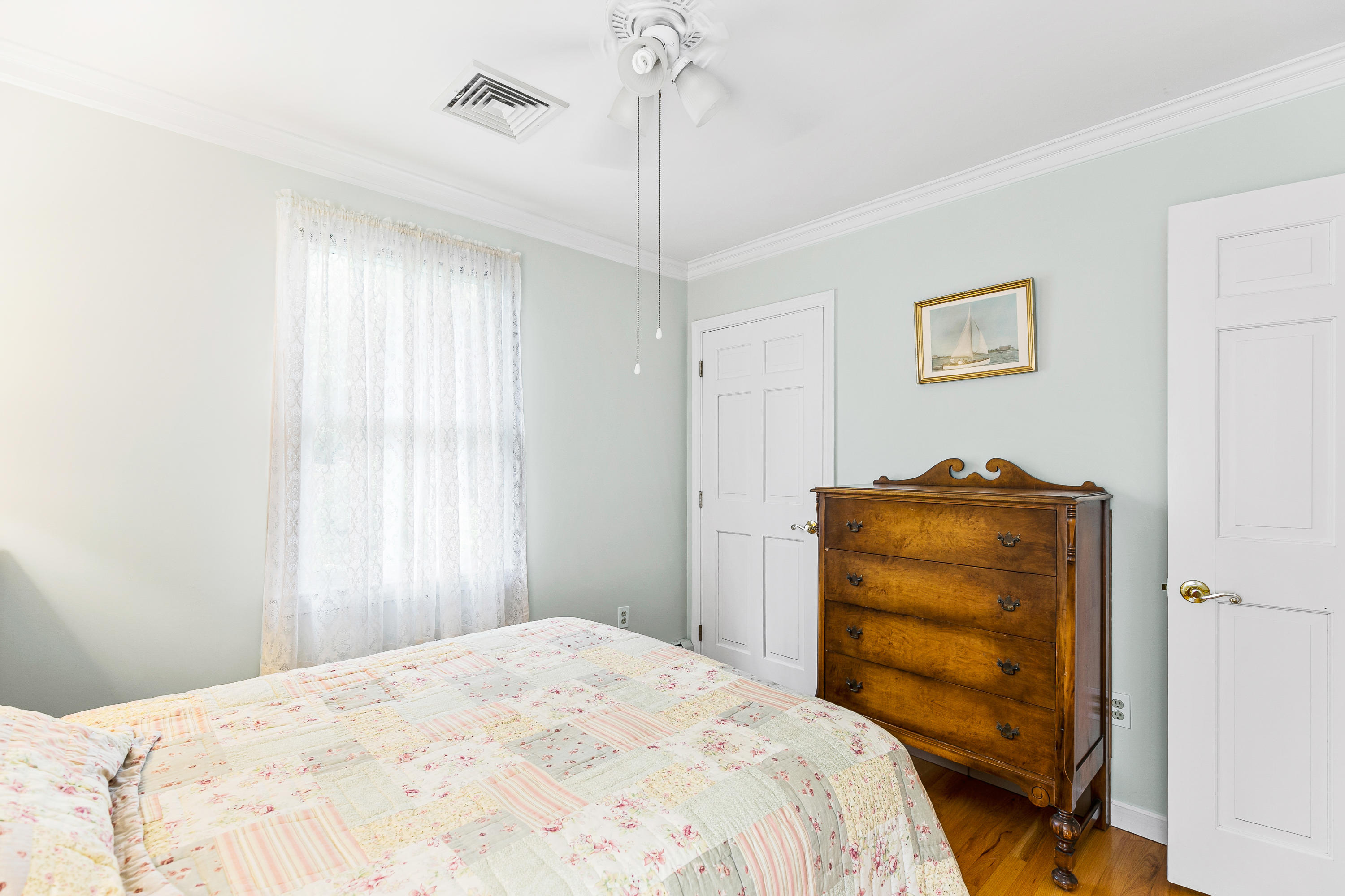 64 Hilltop Road Mashpee, MA 02649 - Photo 25 of 36 a bedroom with a bed and a window