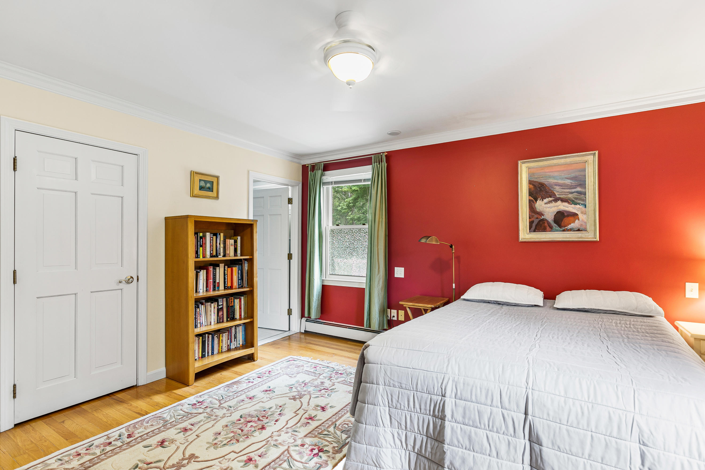 64 Hilltop Road Mashpee, MA 02649 - Photo 27 of 36 a bedroom with a bed and a book shelf