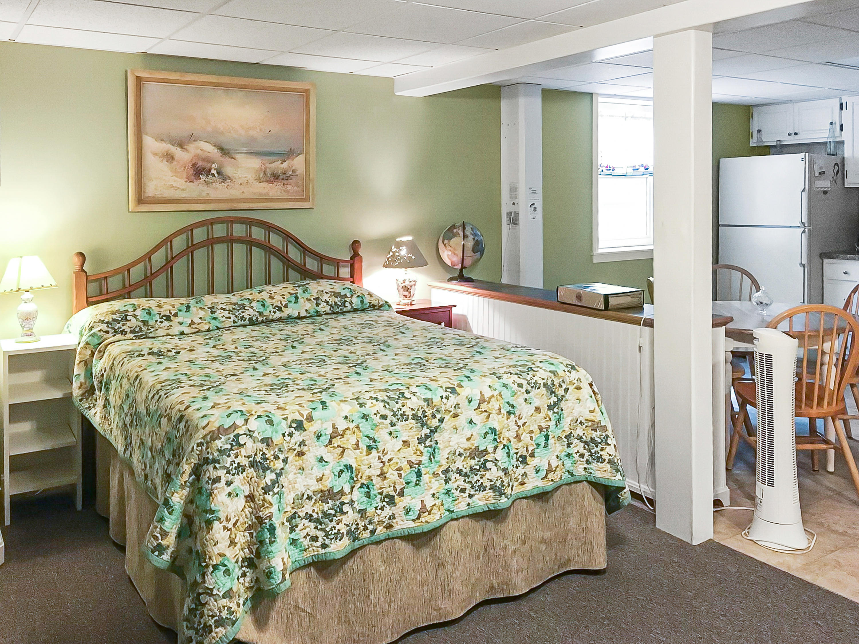 64 Hilltop Road Mashpee, MA 02649 - Photo 30 of 36 a bedroom with a bed and a painting on the wall