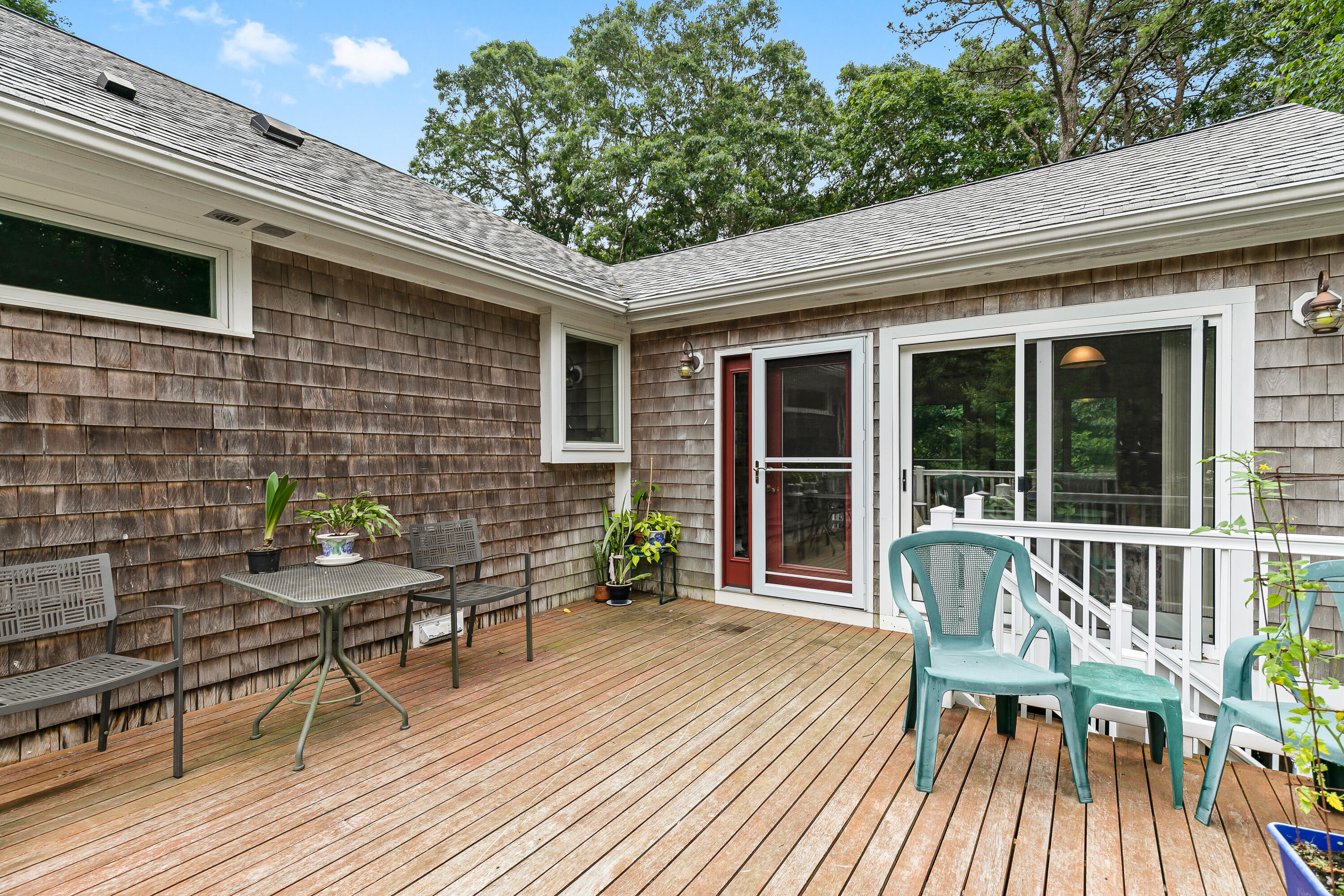 64 Hilltop Road Mashpee, MA 02649 - Photo 32 of 36 a view of a two chairs in the deck