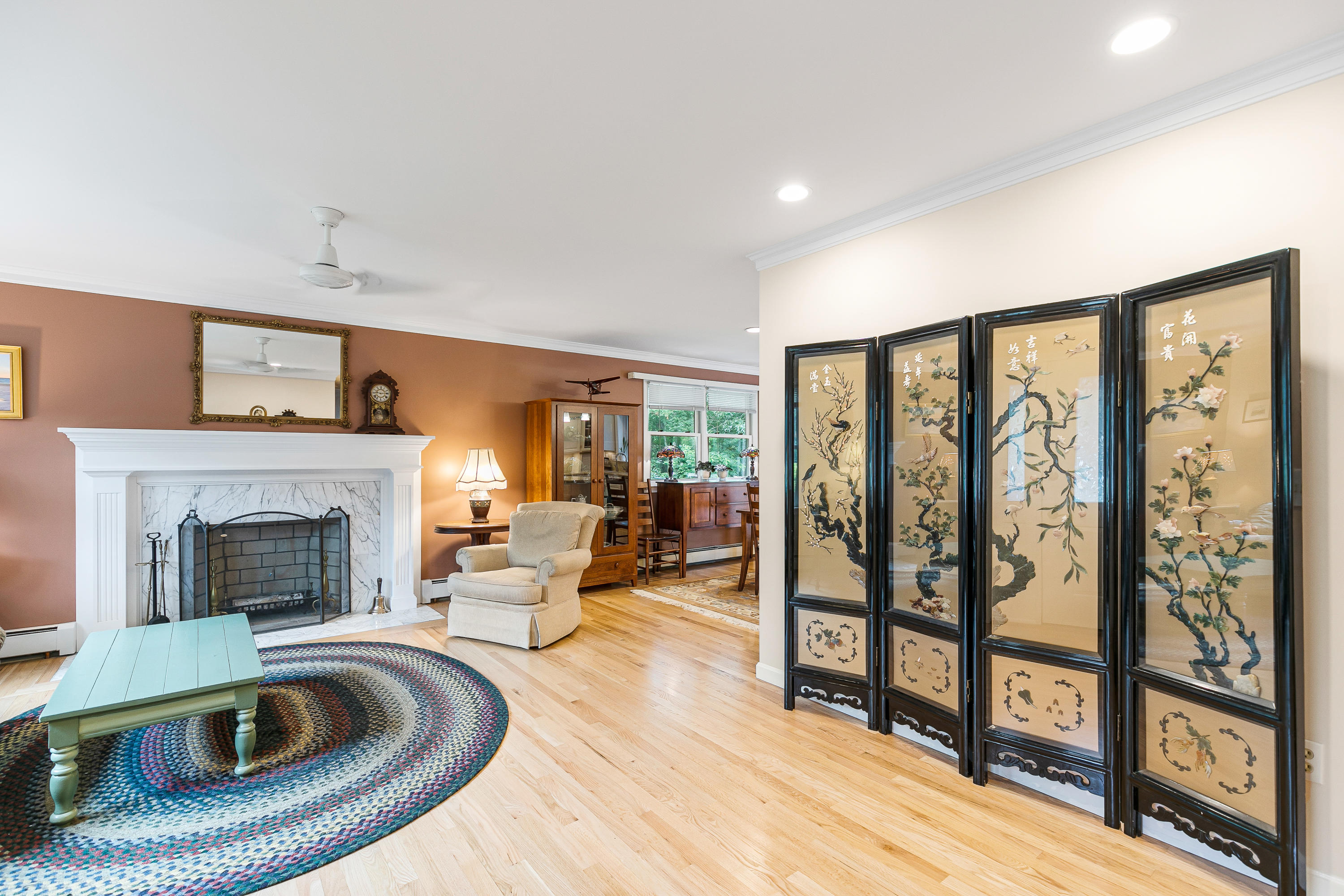 64 Hilltop Road Mashpee, MA 02649 - Photo 6 of 36 a living room with furniture and a fireplace