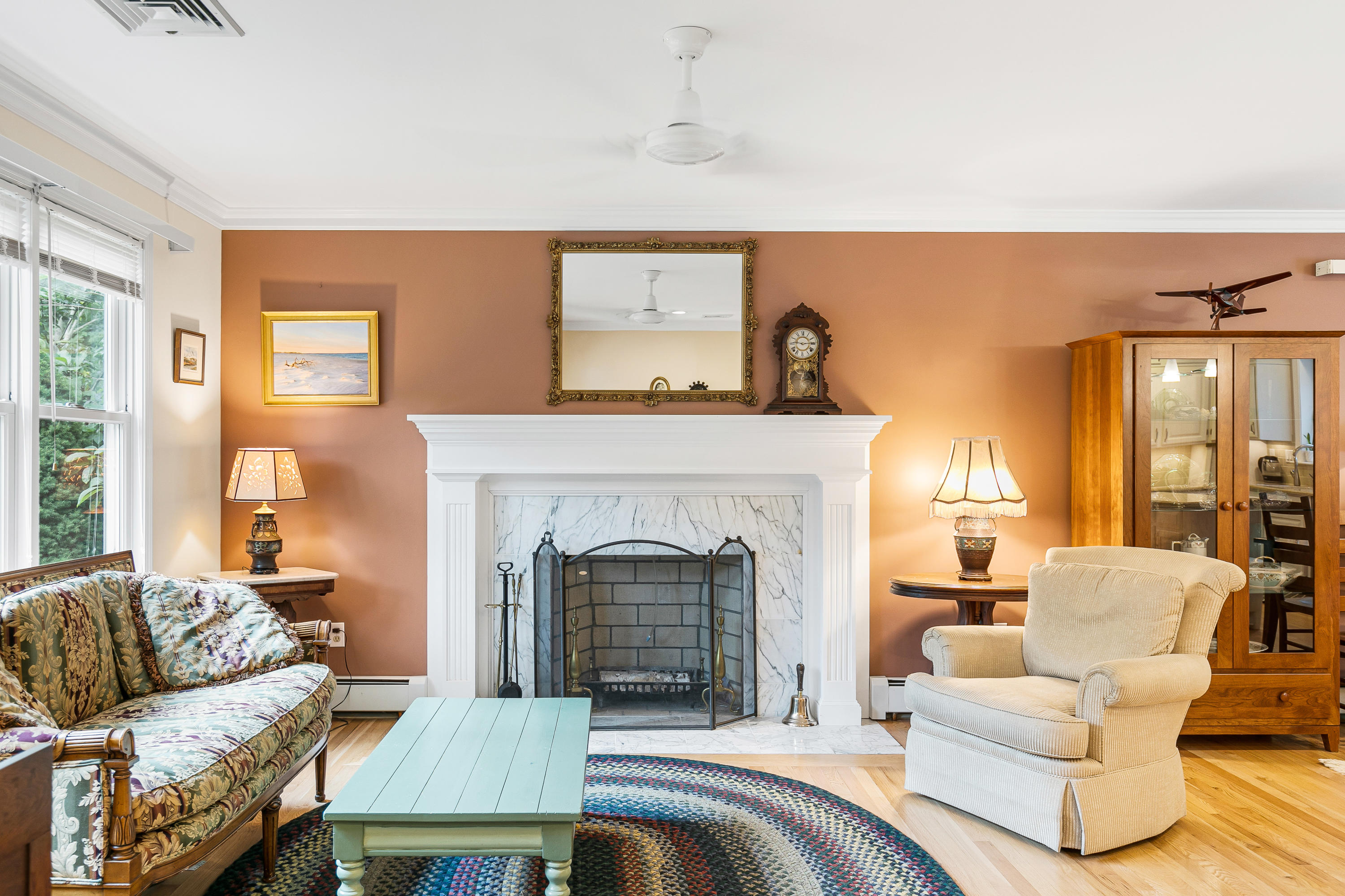 64 Hilltop Road Mashpee, MA 02649 - Photo 7 of 36 a living room with furniture and a fireplace