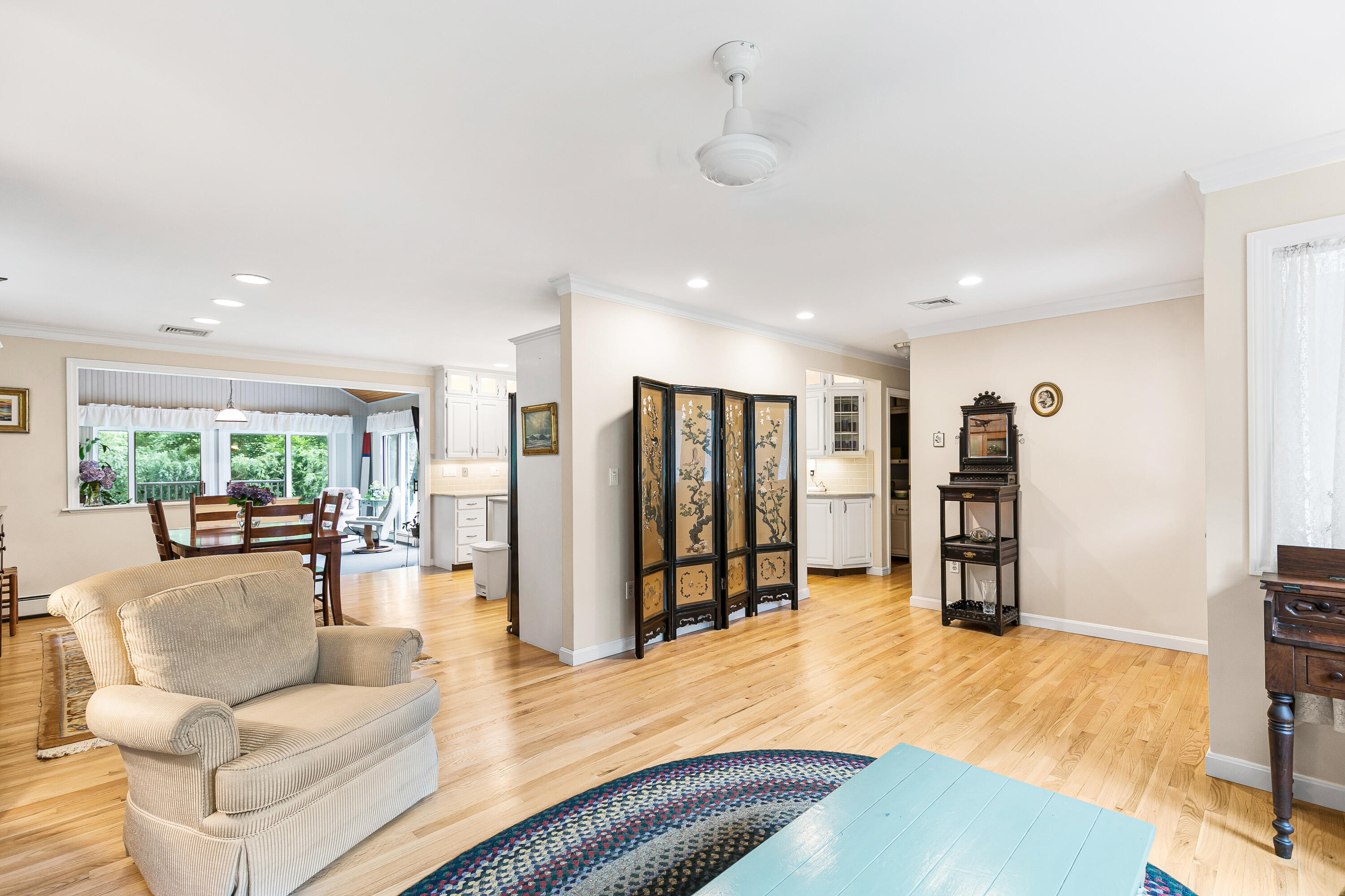 64 Hilltop Road Mashpee, MA 02649 - Photo 9 of 36 a living room with furniture and a flat screen tv