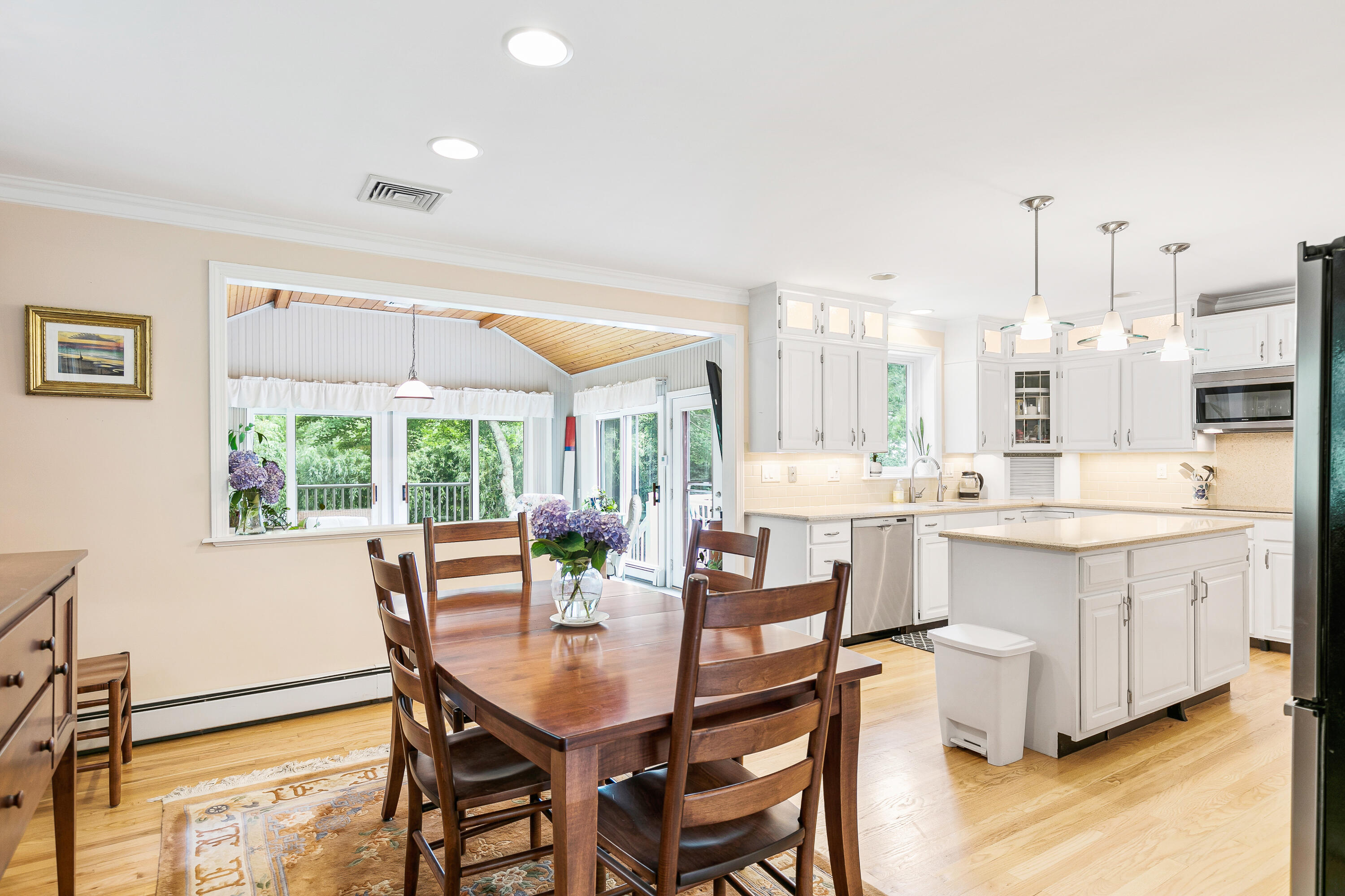 64 Hilltop Road Mashpee, MA 02649 - Photo 10 of 36 a very nice looking dining room with kitchen island furniture a large window and a sink