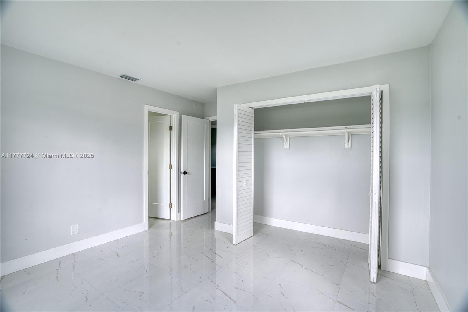 697 Pawnee Street Jupiter, FL 33458 - Photo 18 of 46 a view of an empty room
