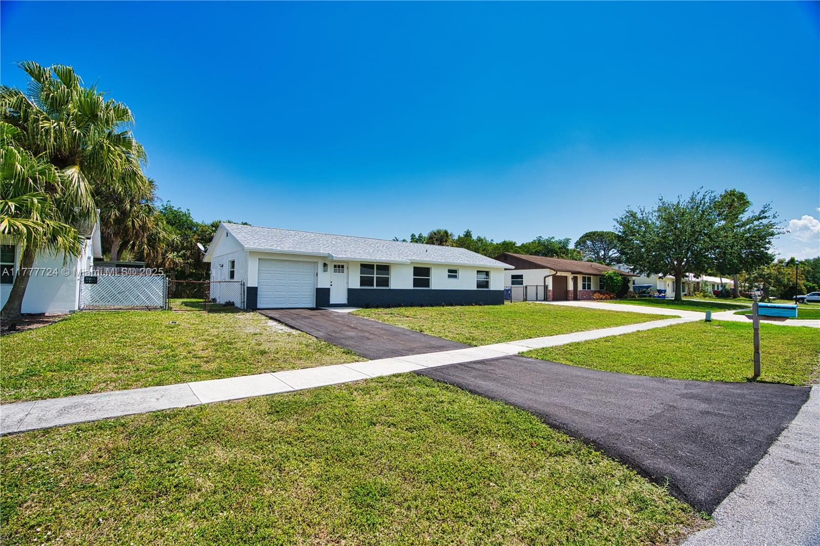 697 Pawnee Street Jupiter, FL 33458 - Photo 30 of 46 a view of outdoor space and yard