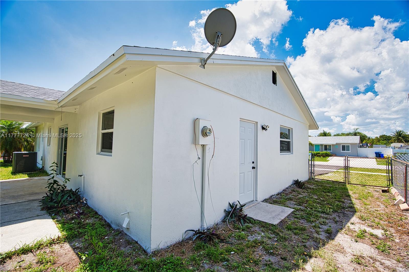 697 Pawnee Street Jupiter, FL 33458 - Photo 32 of 46 a front view of a house with garden