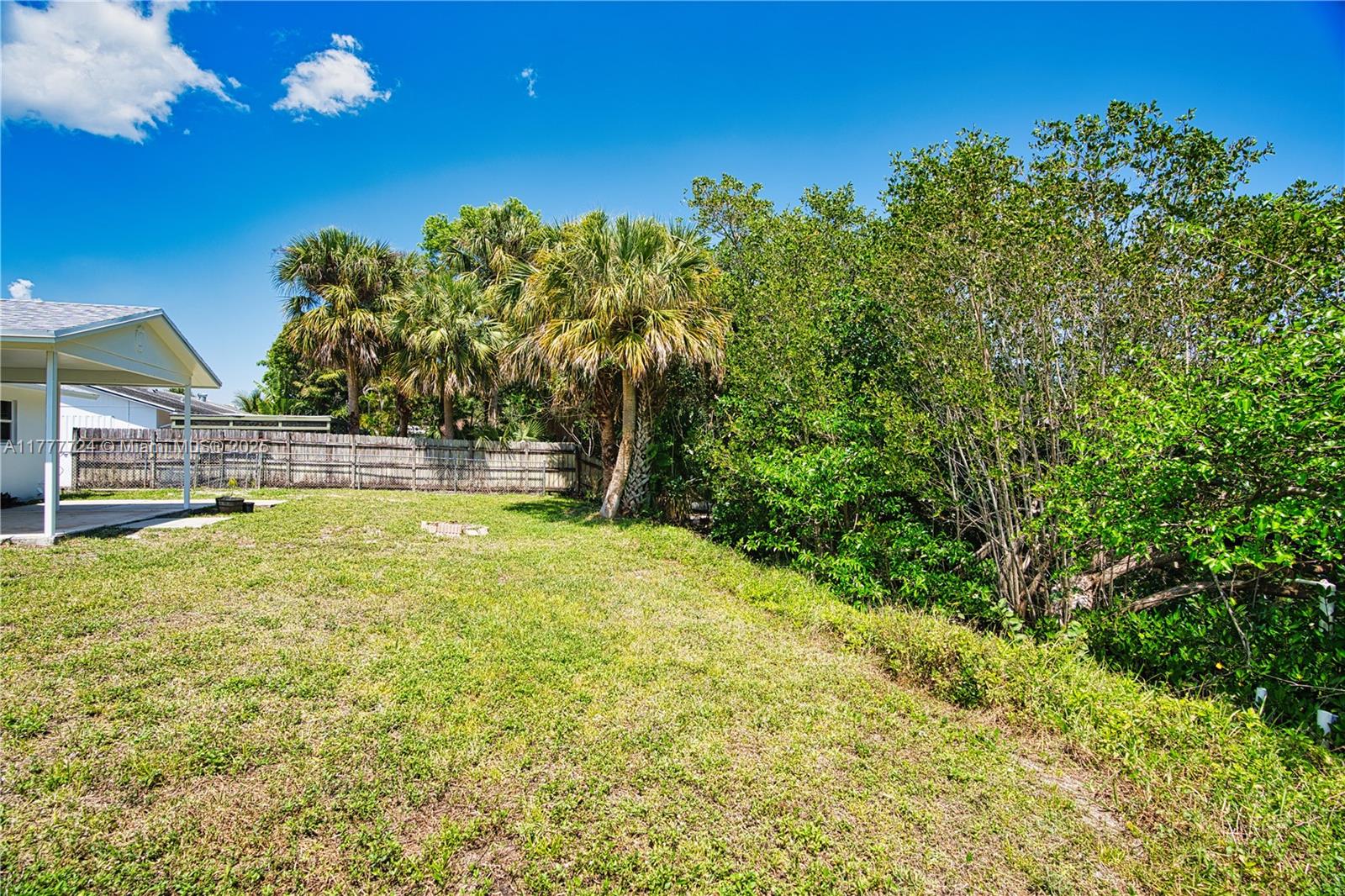 697 Pawnee Street Jupiter, FL 33458 - Photo 37 of 46 a view of outdoor space and yard