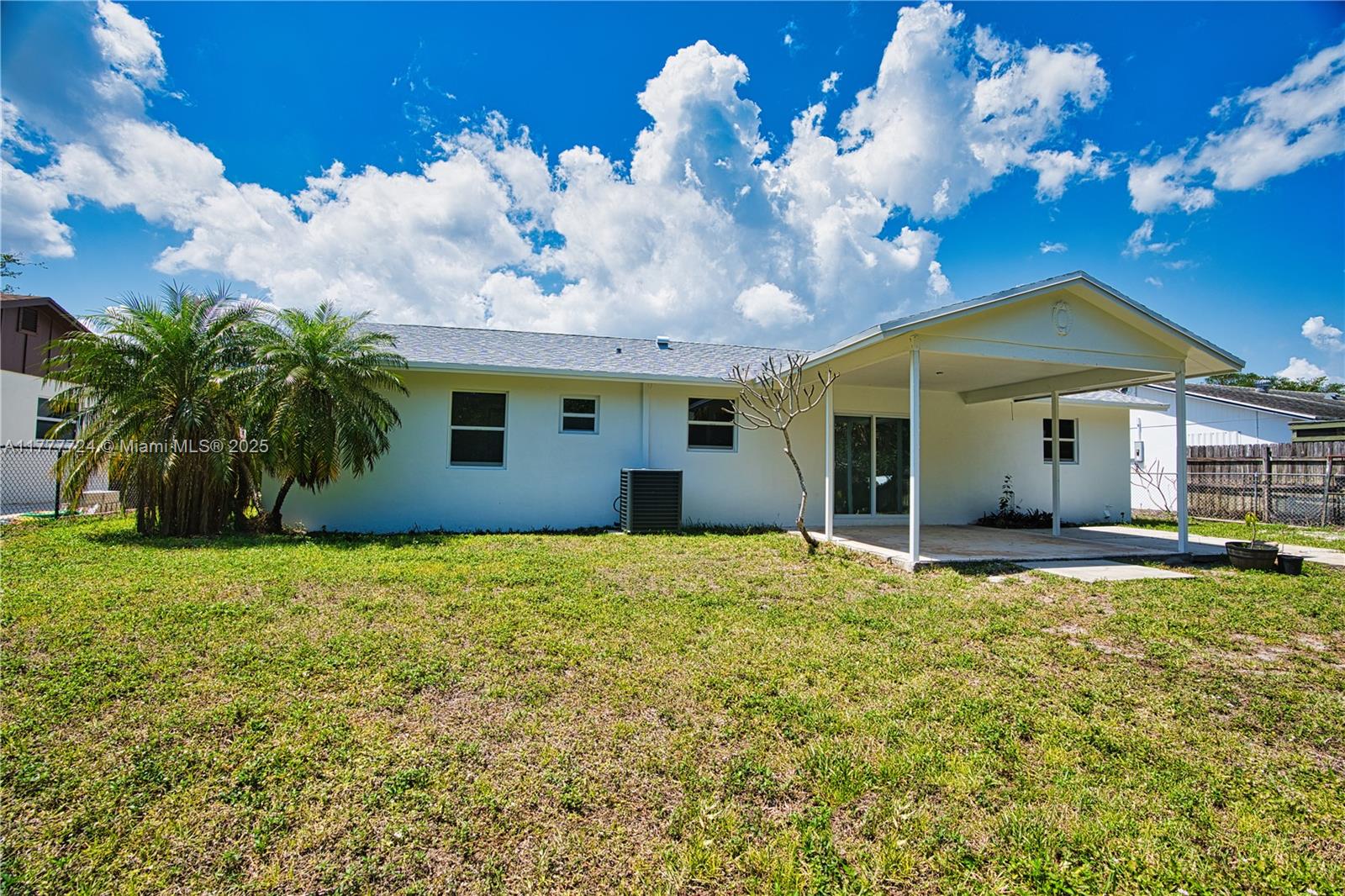697 Pawnee Street Jupiter, FL 33458 - Photo 39 of 46 a view of a house with backyard and garden