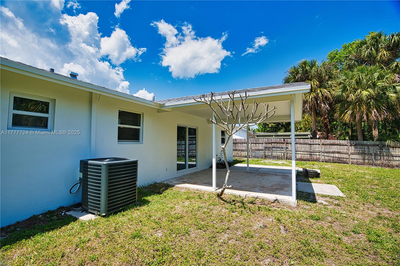 697 Pawnee Street Jupiter, FL 33458 - Photo 41 of 46 a view of a porch with furniture and a yard