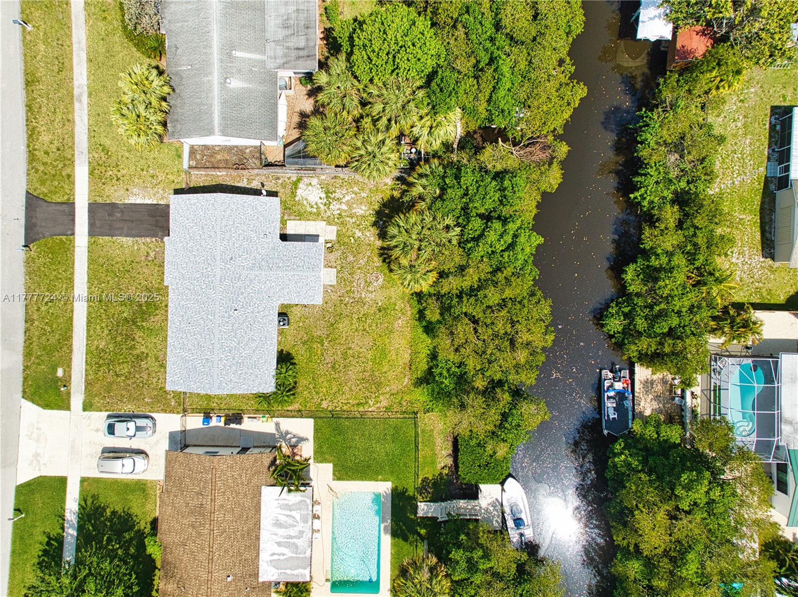 697 Pawnee Street Jupiter, FL 33458 - Photo 5 of 46 an aerial view of a residential apartment building with a yard
