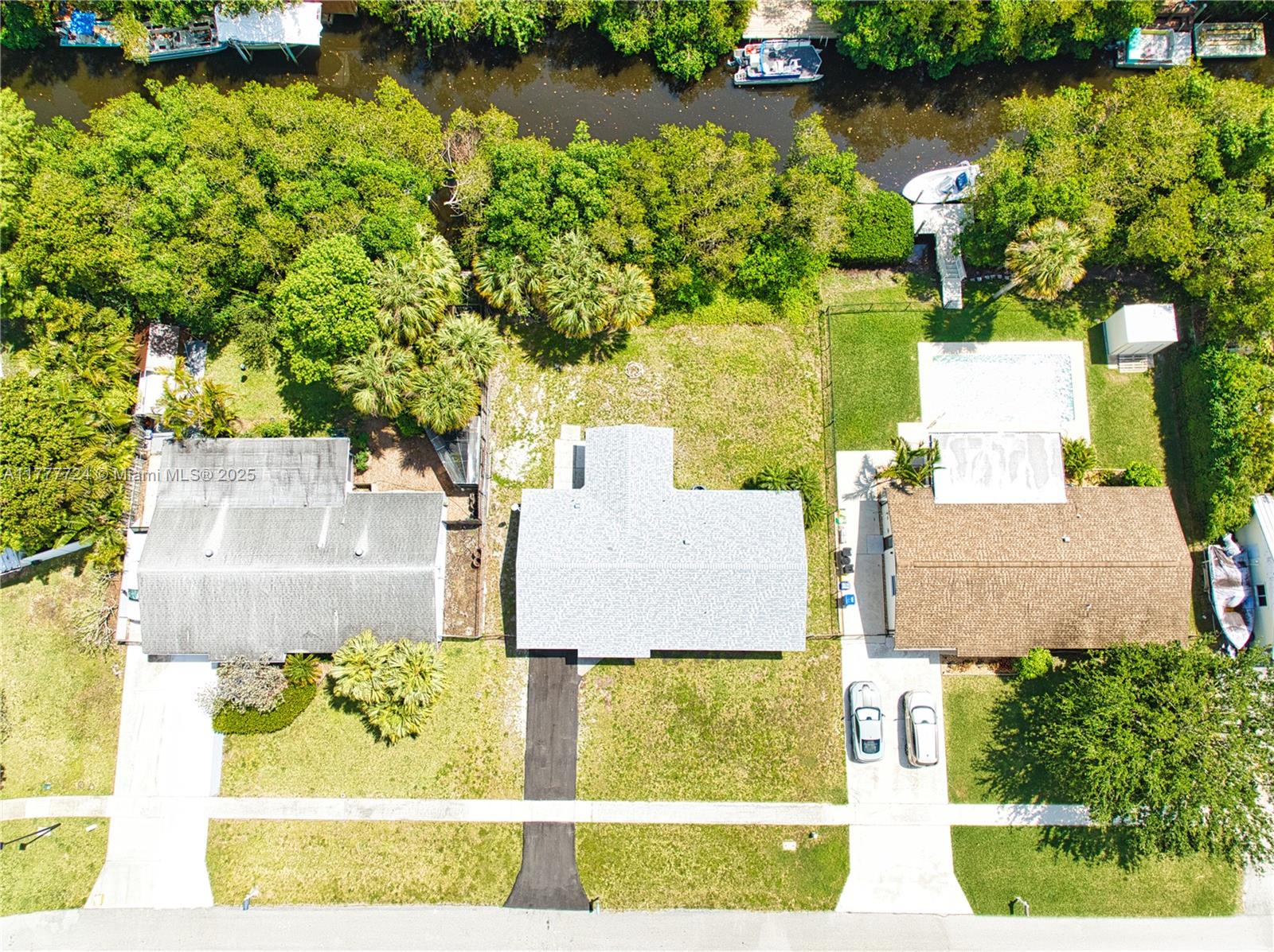 697 Pawnee Street Jupiter, FL 33458 - Photo 7 of 46 an aerial view of residential house with outdoor space and swimming pool
