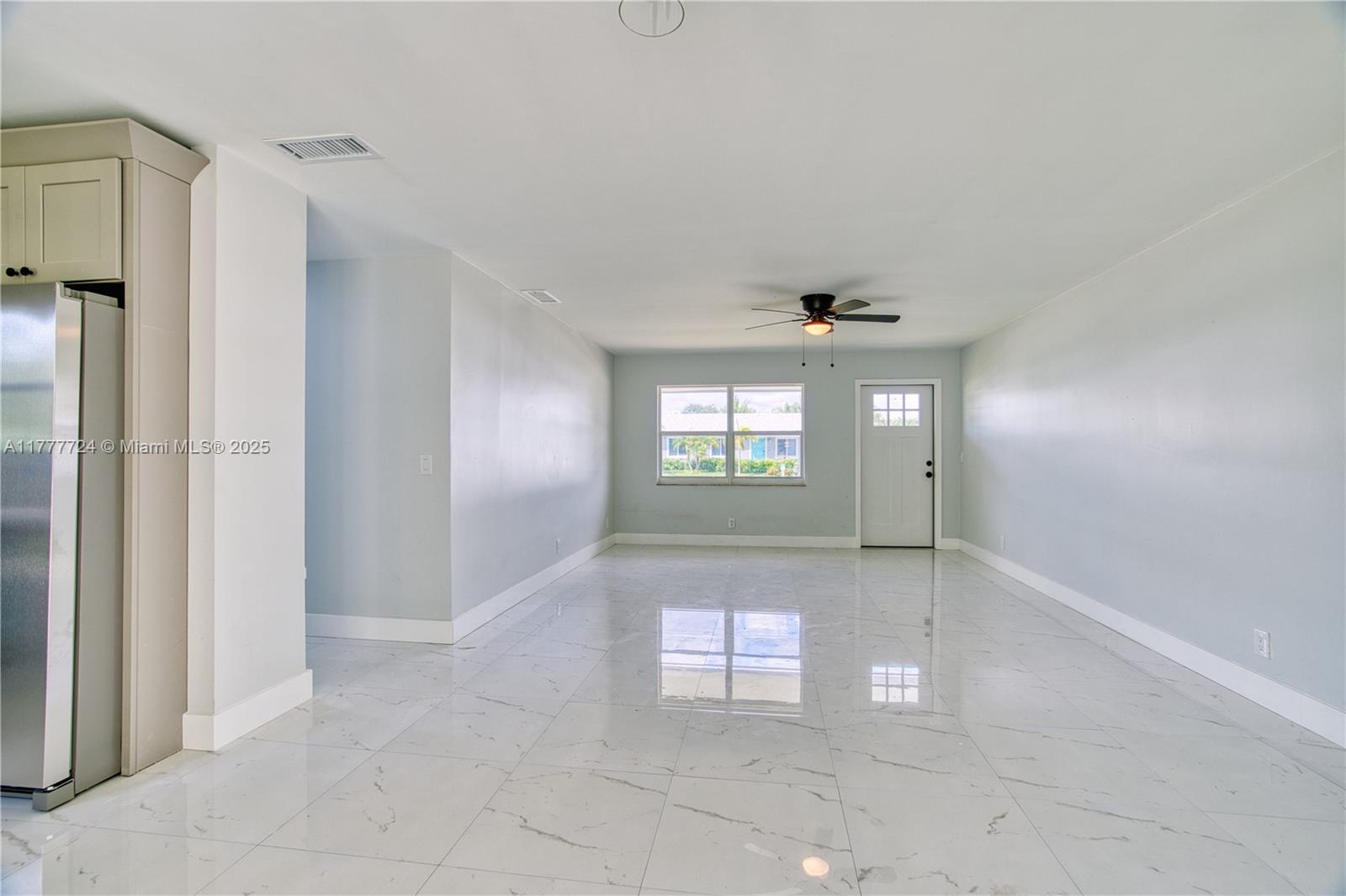 697 Pawnee Street Jupiter, FL 33458 - Photo 8 of 46 a view of an empty room and window