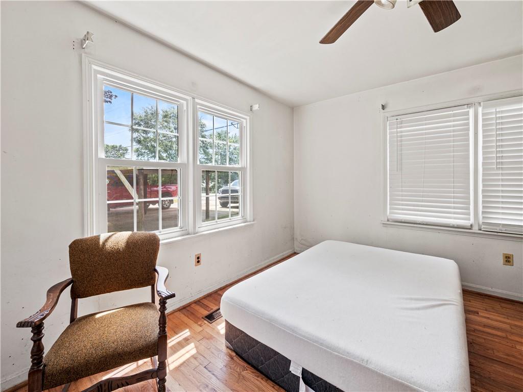 4065 Jot Em Down Road Cumming, GA 30028 - Photo 12 of 19 a bedroom with furniture and a window