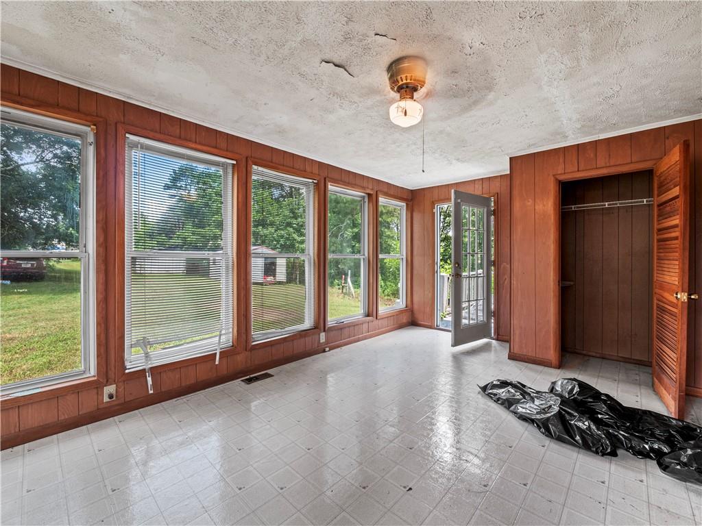 4065 Jot Em Down Road Cumming, GA 30028 - Photo 15 of 19 a view of a room with wooden floor and windows