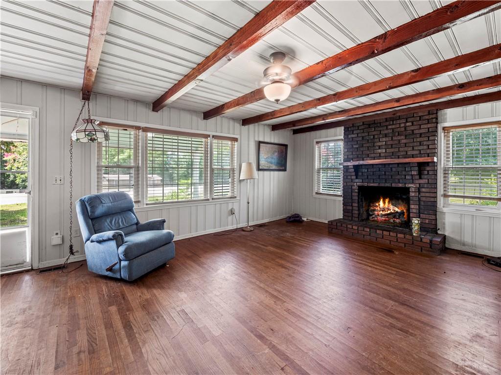 4065 Jot Em Down Road Cumming, GA 30028 - Photo 7 of 19 a living room with furniture and a fireplace