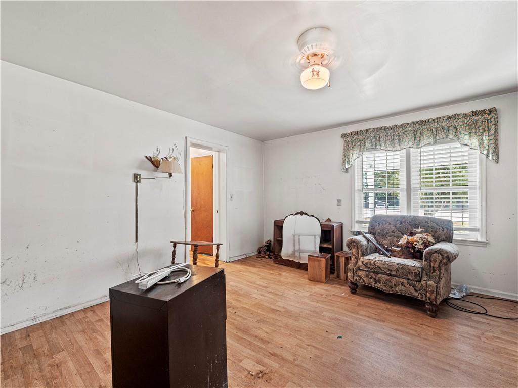 4065 Jot Em Down Road Cumming, GA 30028 - Photo 9 of 19 a living room with furniture and a window