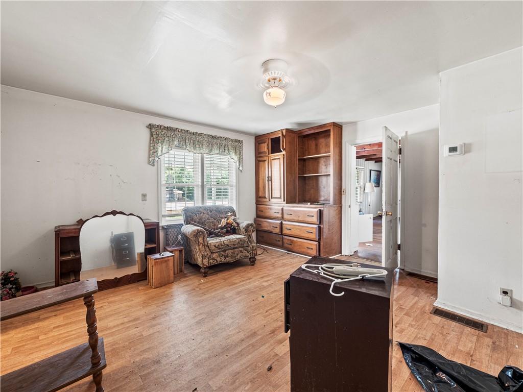 4065 Jot Em Down Road Cumming, GA 30028 - Photo 10 of 19 a living room with furniture window and wooden floor