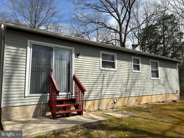303 Three Bridge Road Monroeville, NJ 08343 - Photo 11 of 13 a view of a house with a patio