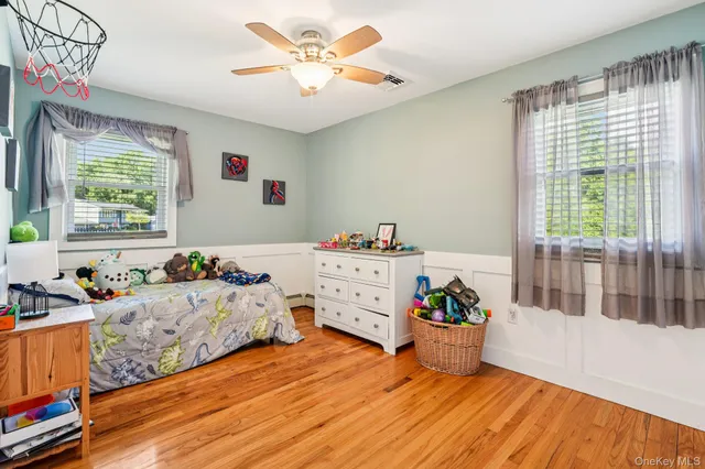 a room with furniture and wooden floor