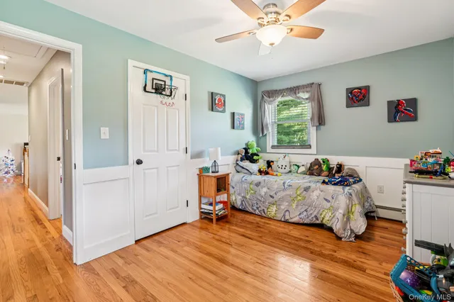 a bathroom with a granite countertop sink toilet and a mirror