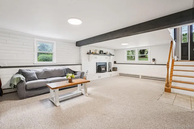 a living room with furniture and a window