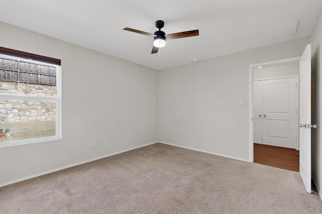 5516 McClelland Street Forney, TX 75126 - Photo 17 of 36 Spare room featuring light carpet and ceiling fan