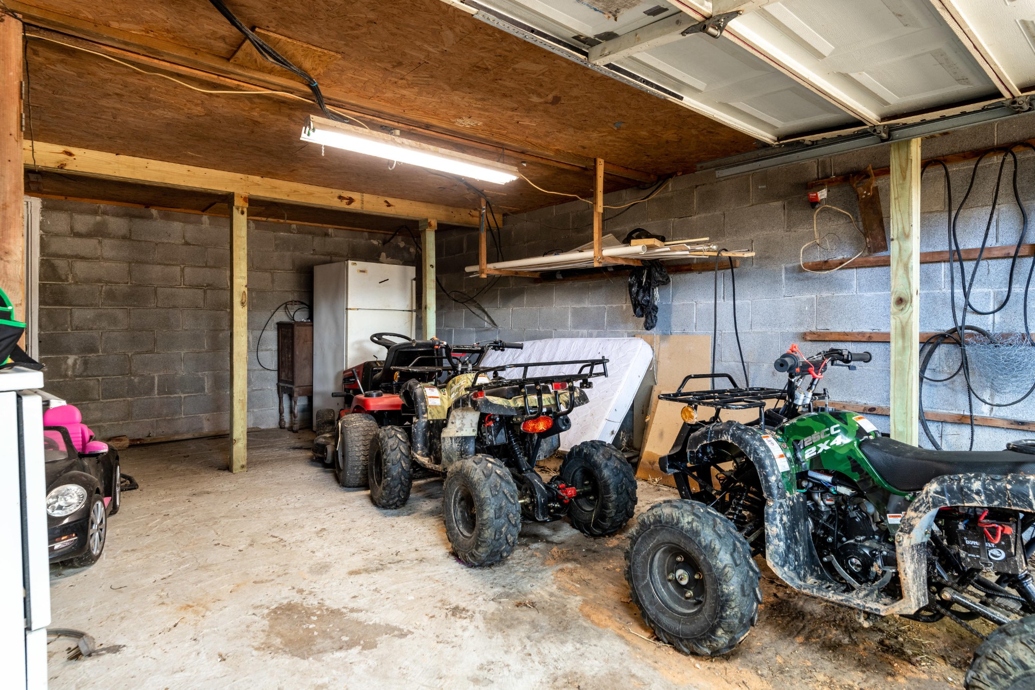 232 Pattie Gap Road Philadelphia, TN 37846 - Photo 24 of 31 a view of a garage with a bike and car