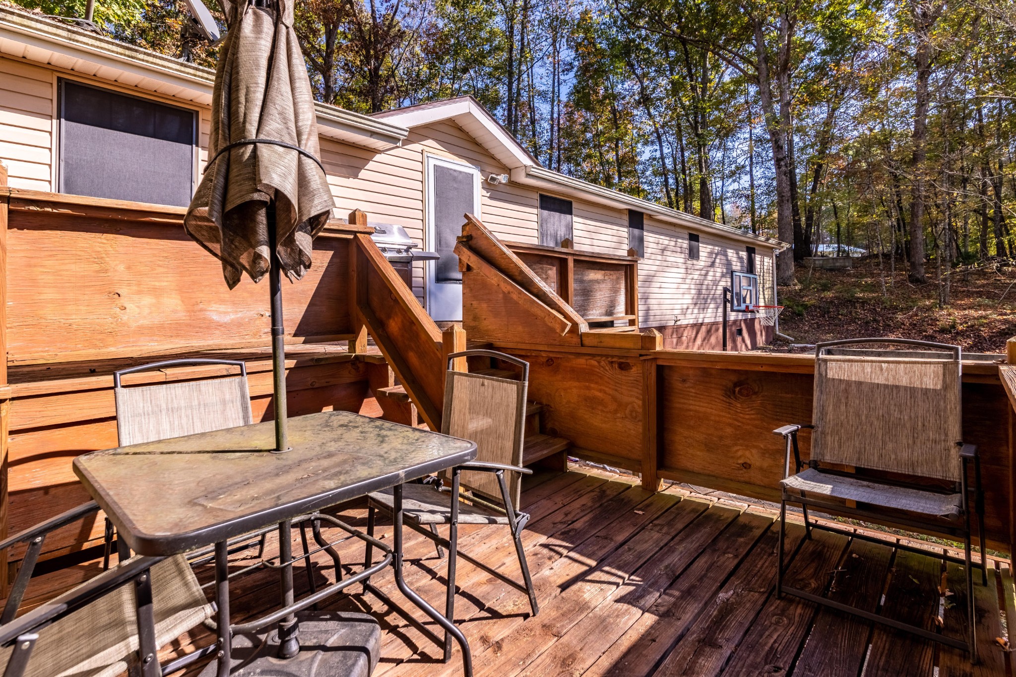 232 Pattie Gap Road Philadelphia, TN 37846 - Photo 29 of 31 a view of a roof deck with table and chairs with wooden floor and fence