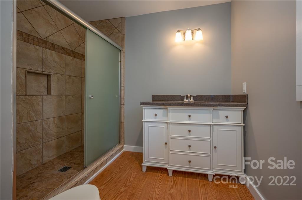 241 Hidden Hill Road Tryon, NC 28782 - Photo 16 of 39 a view of a closet area with wooden floor