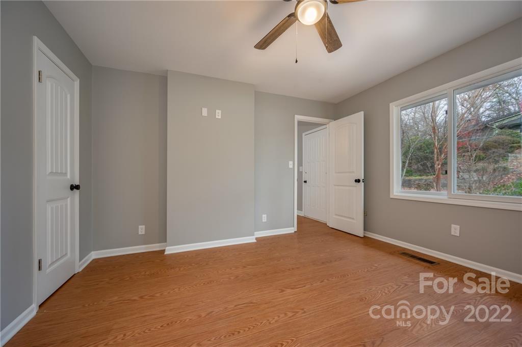 241 Hidden Hill Road Tryon, NC 28782 - Photo 19 of 39 a view of an empty room with a window