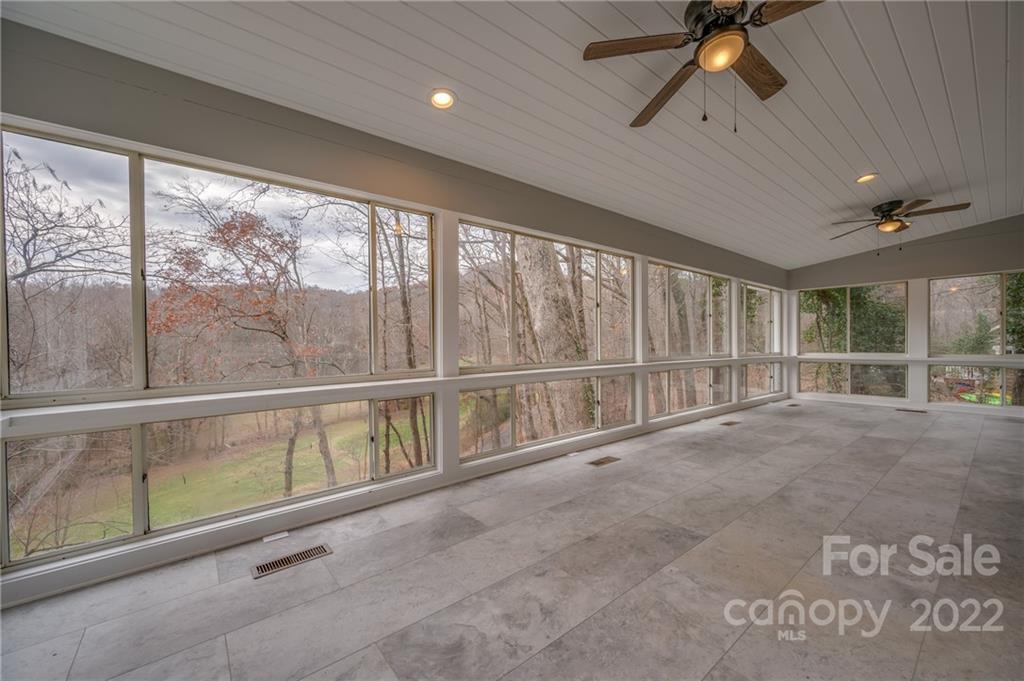 241 Hidden Hill Road Tryon, NC 28782 - Photo 21 of 39 a view of an empty room with a window