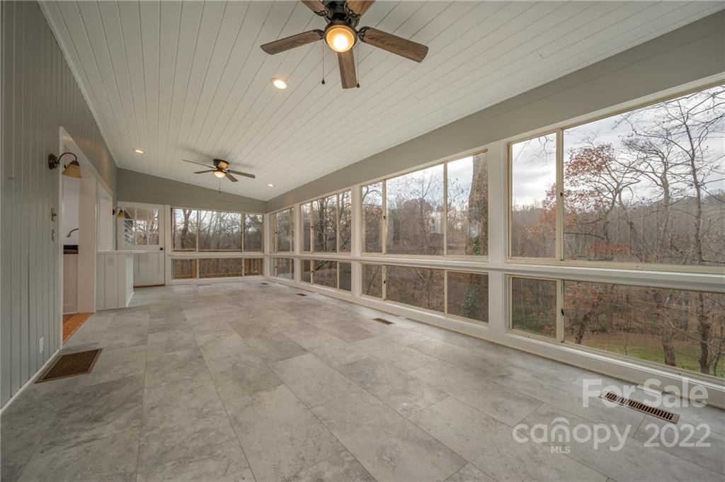 241 Hidden Hill Road Tryon, NC 28782 - Photo 22 of 39 a view of an empty room with a window