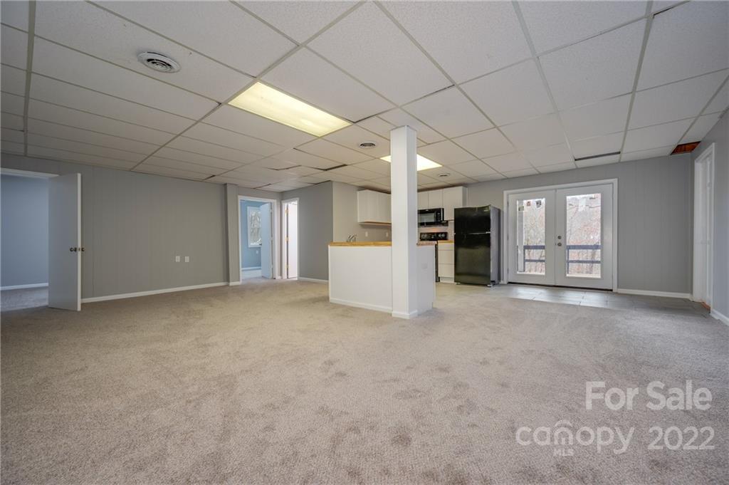 241 Hidden Hill Road Tryon, NC 28782 - Photo 23 of 39 a view of an empty room with a window